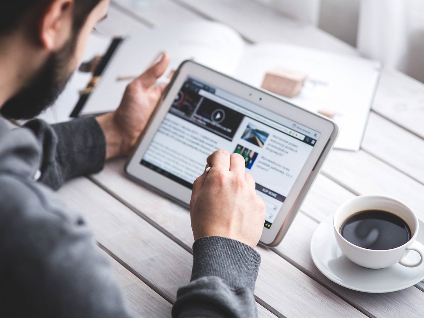 Person Working on Tablet