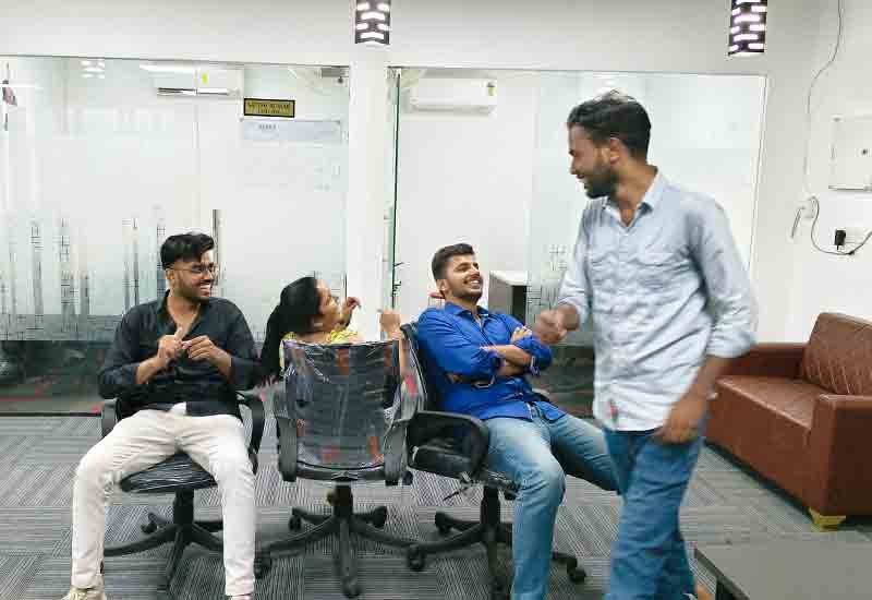 Happy faces at Weblytic Labs participating in a fun team event