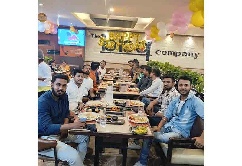 Weblytic Labs team smiling during a relaxed lunch outing